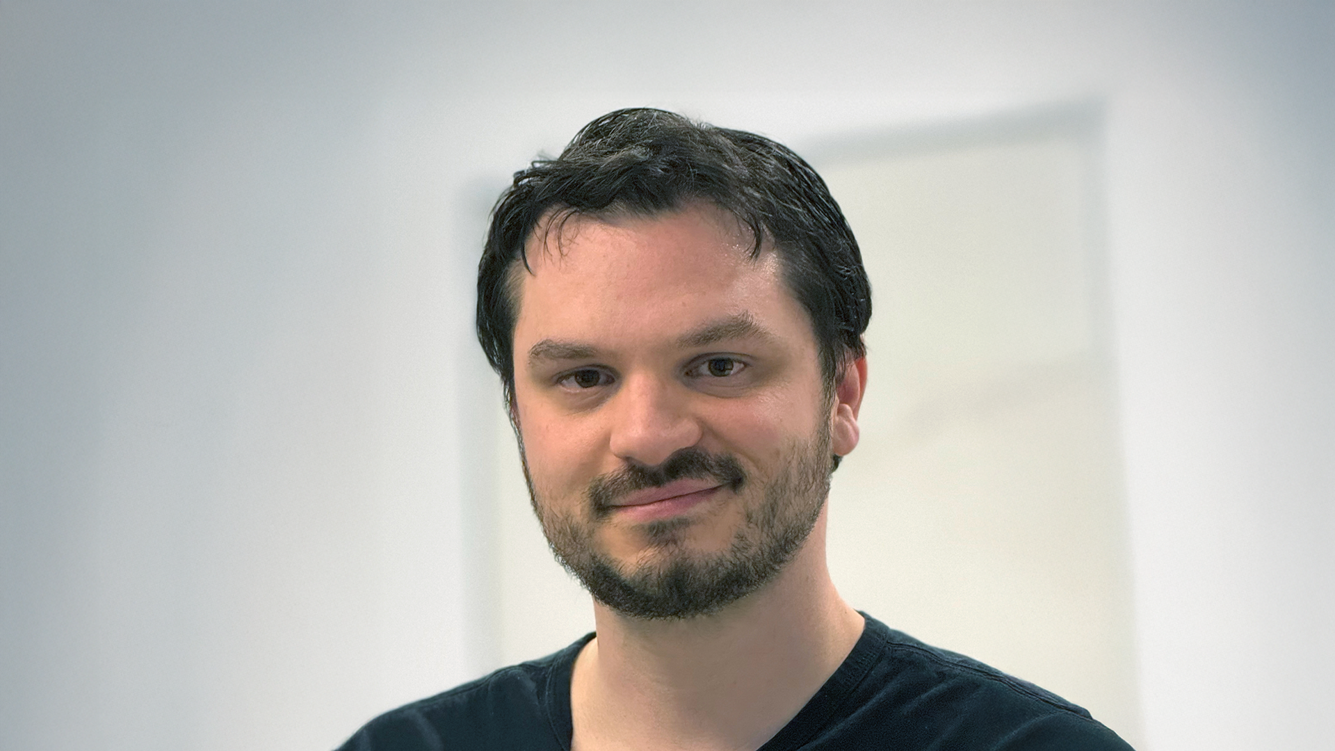 A photo of Abe Davis, a man with dark brown hair.