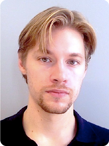 A color photo of a man.