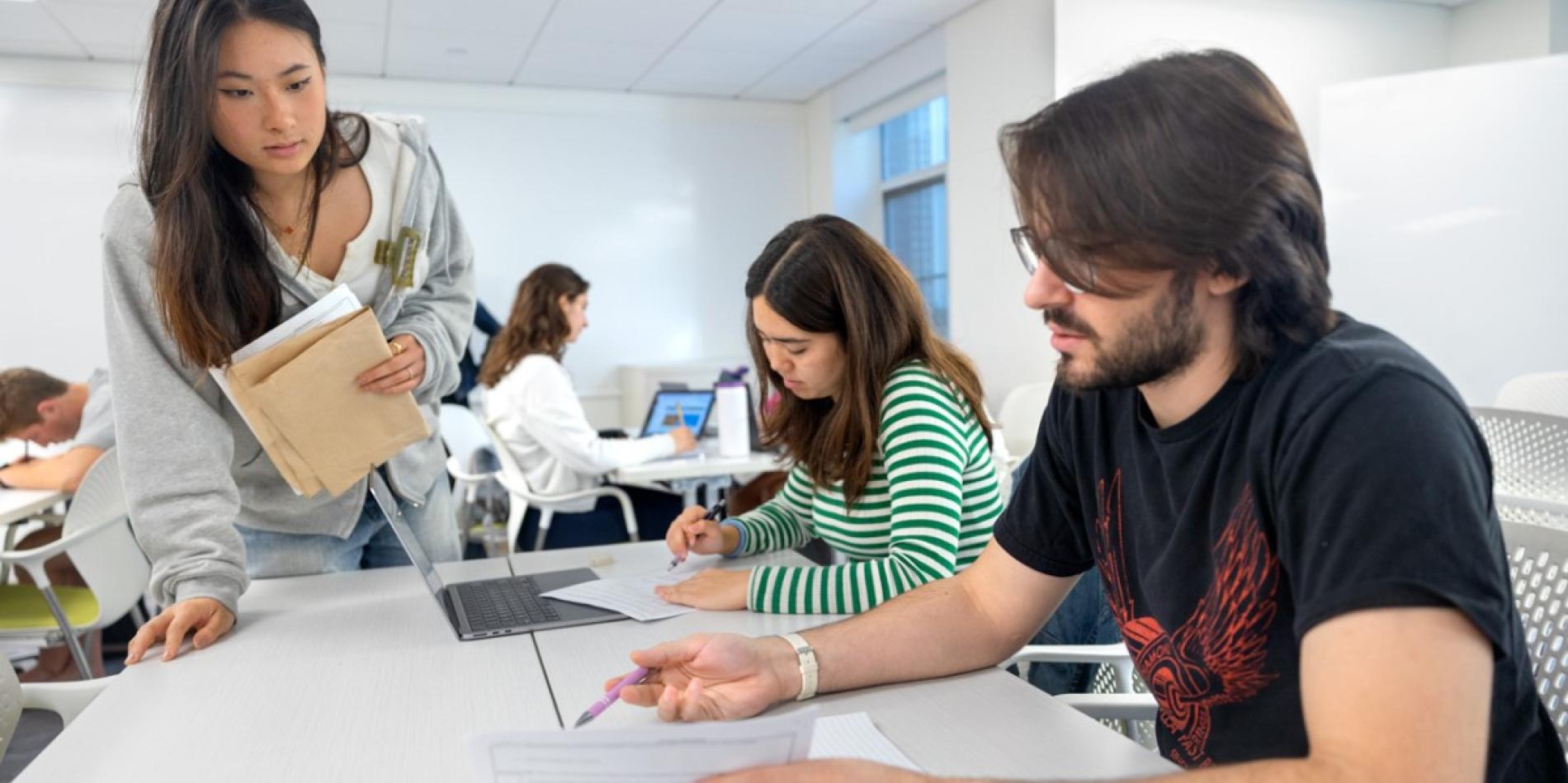 A color photo showing students working.