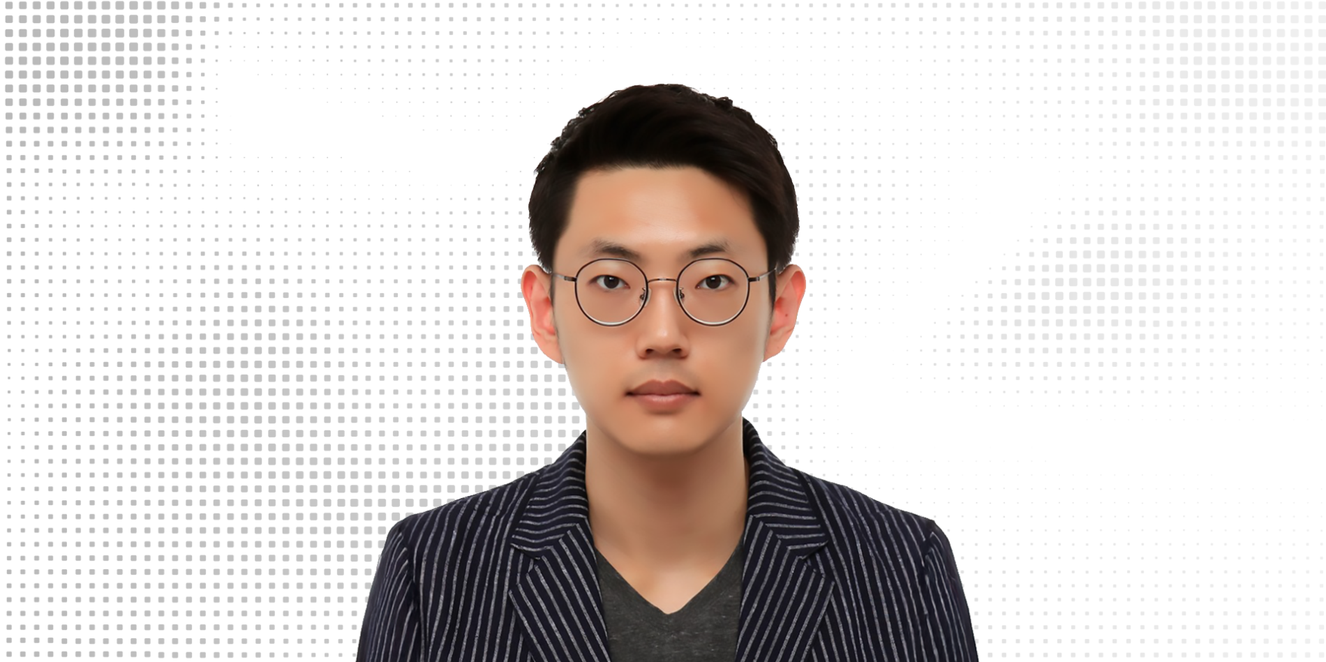 A color photo of a man with glasses.