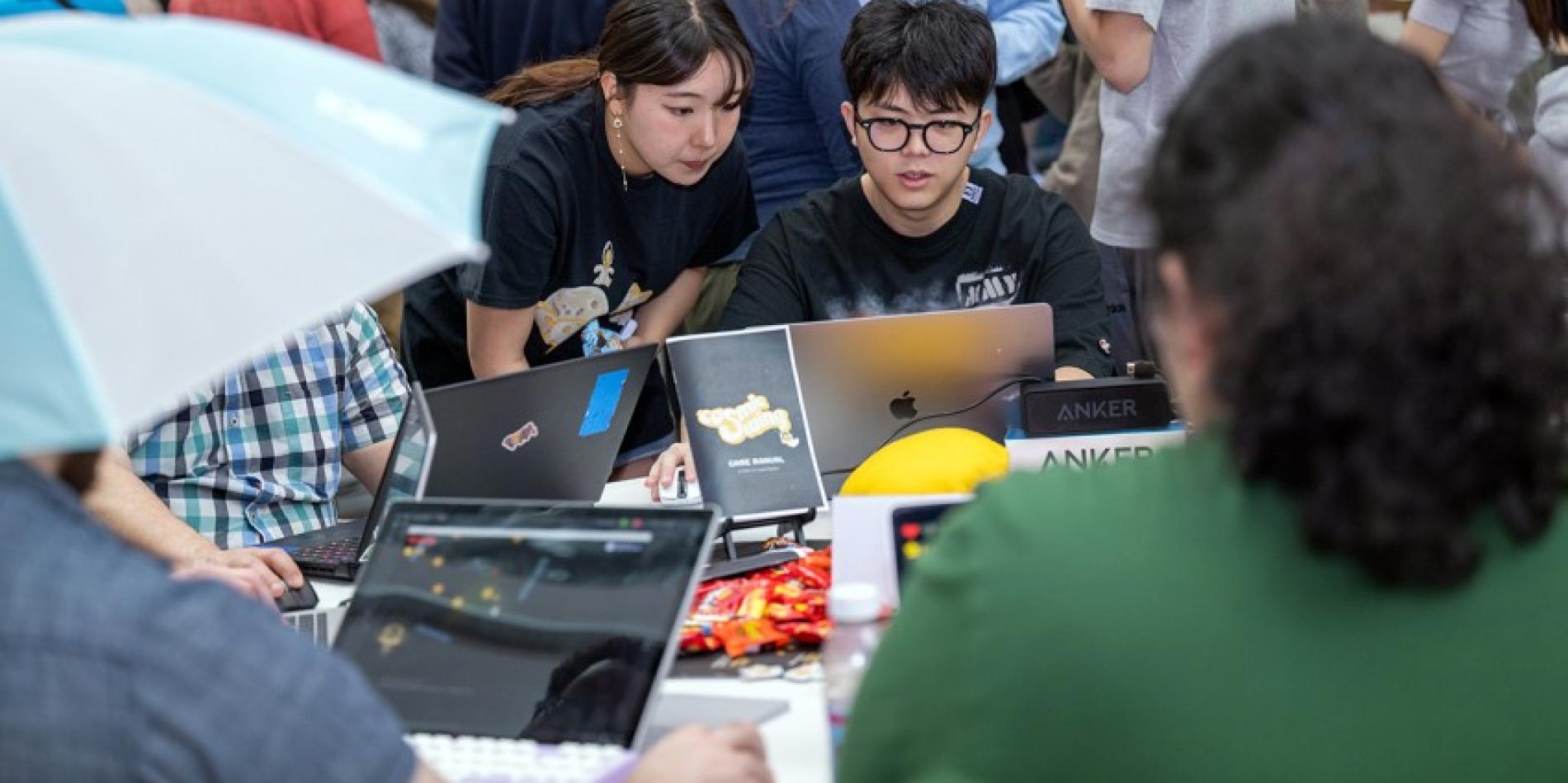 Visitors test drive new games at a previous GDIAC showcase