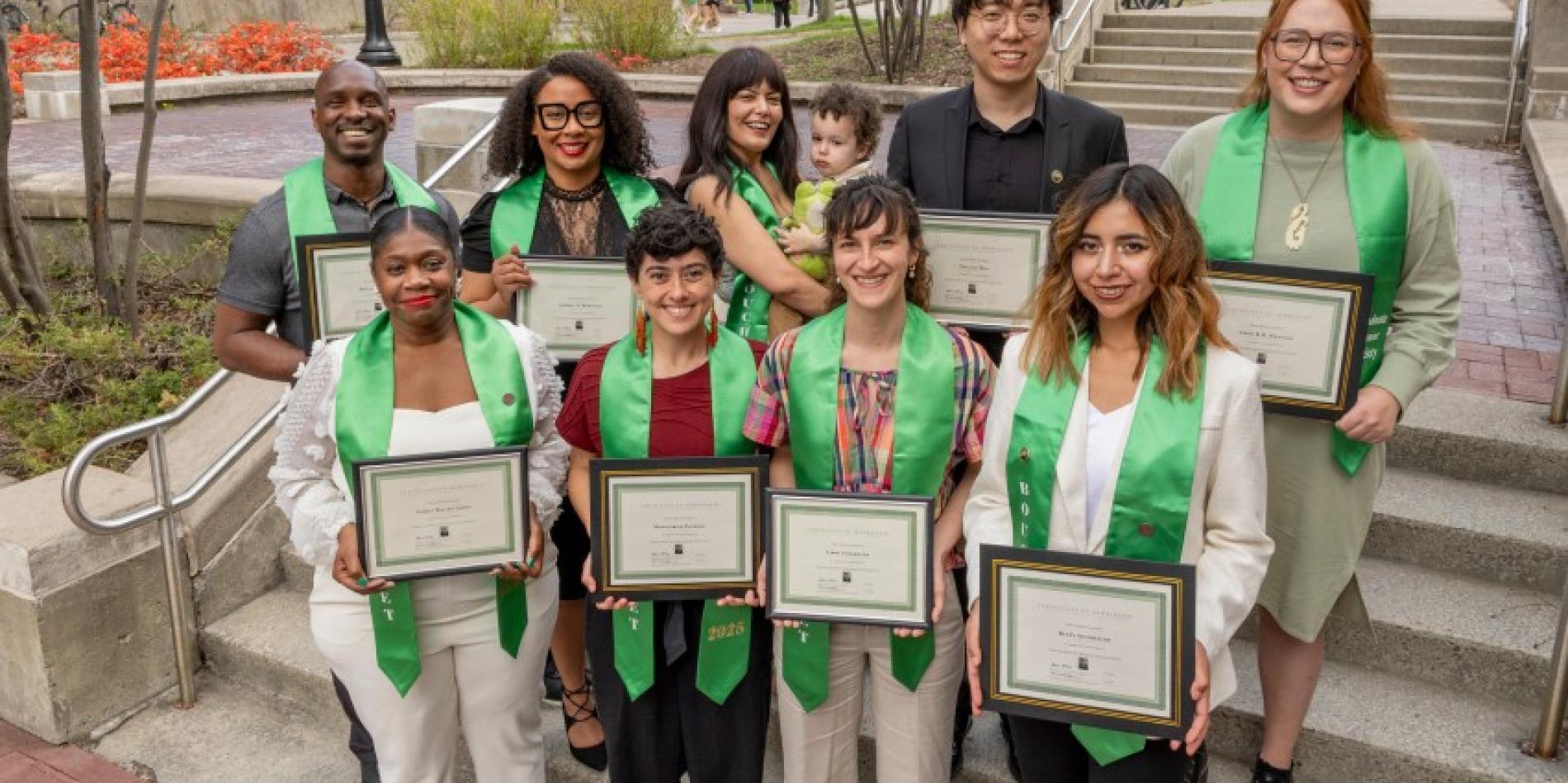Cornell's nine 2025 Bouchet Scholars with one of the scholar's sons