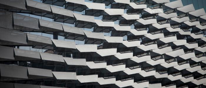 gray metal fins layered on the side of Gates Hall