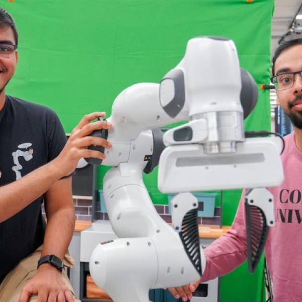 Kushal Kedia (left), a doctoral student in the field of computer science, and Prithwish Dan, M.S. ’26, are members of the development team behind RHyME, a system that allows robots to learn tasks by watching a single how-to video.