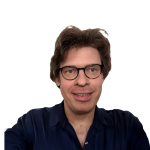 A photo of Immanuel Trummer, a man with brown hair, glasses, in front of a white background