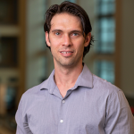 Portrait of man in dress shirt, black hair
