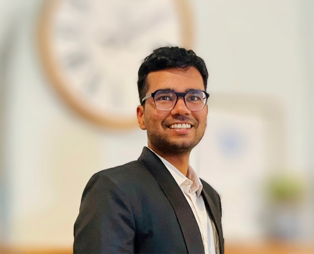 A color photo of Devansh Agarwal in front of a blurred background