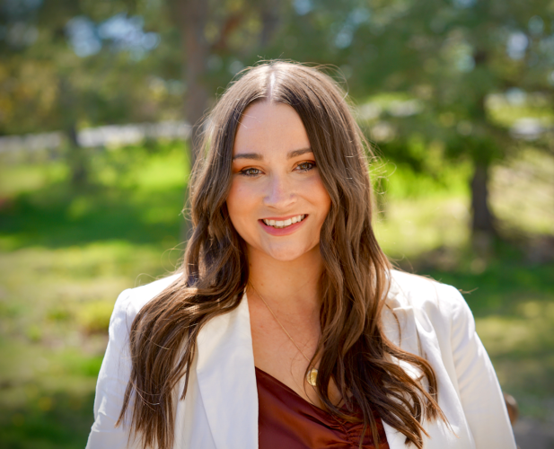 A color photo of Rebecca Fox standing outside