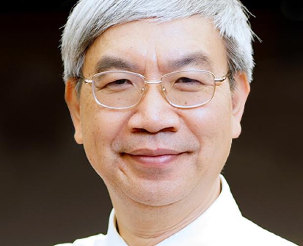 Portrait of man with glasses and graying hair 