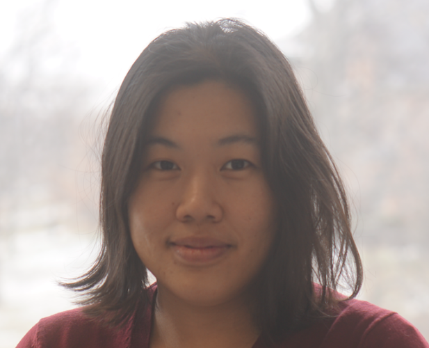 portrait of Woman with short brown hair looking at camera