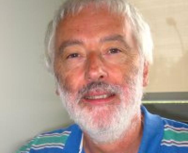man looking at camera, white beard and hair