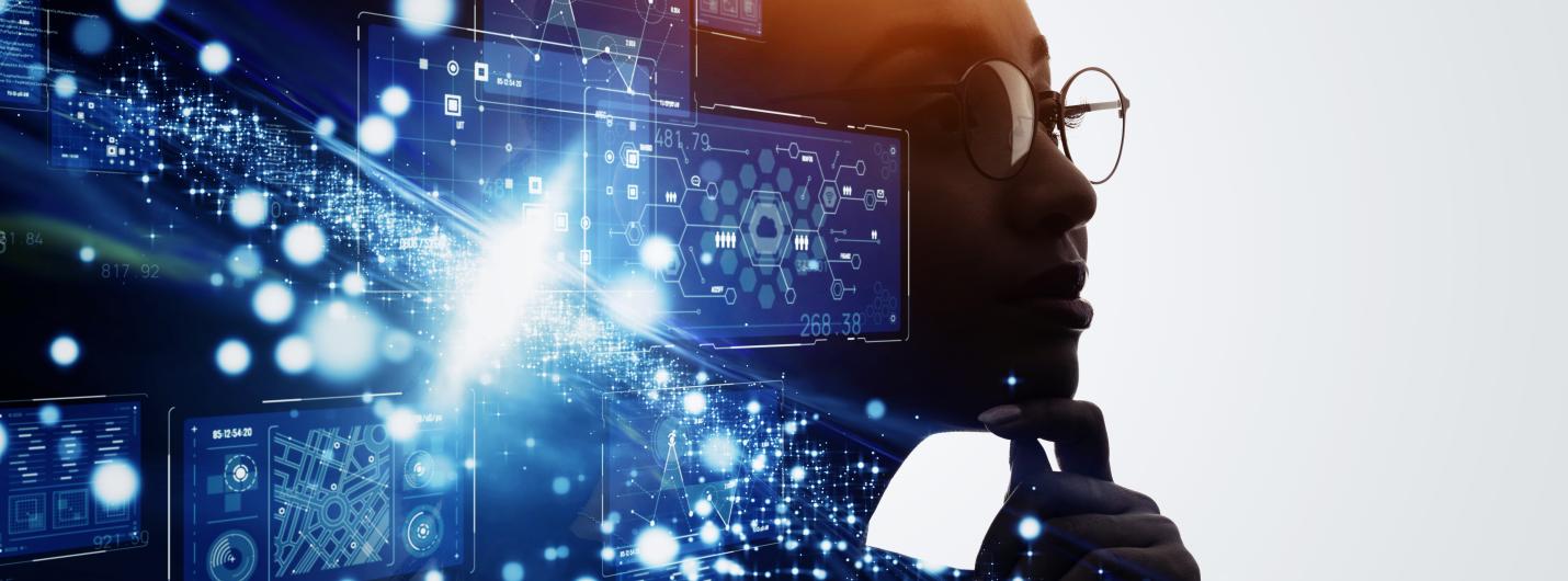 blue pixels and lights collide on the left side of a dark face outline merging into the side profile of a human with glasses on thinking