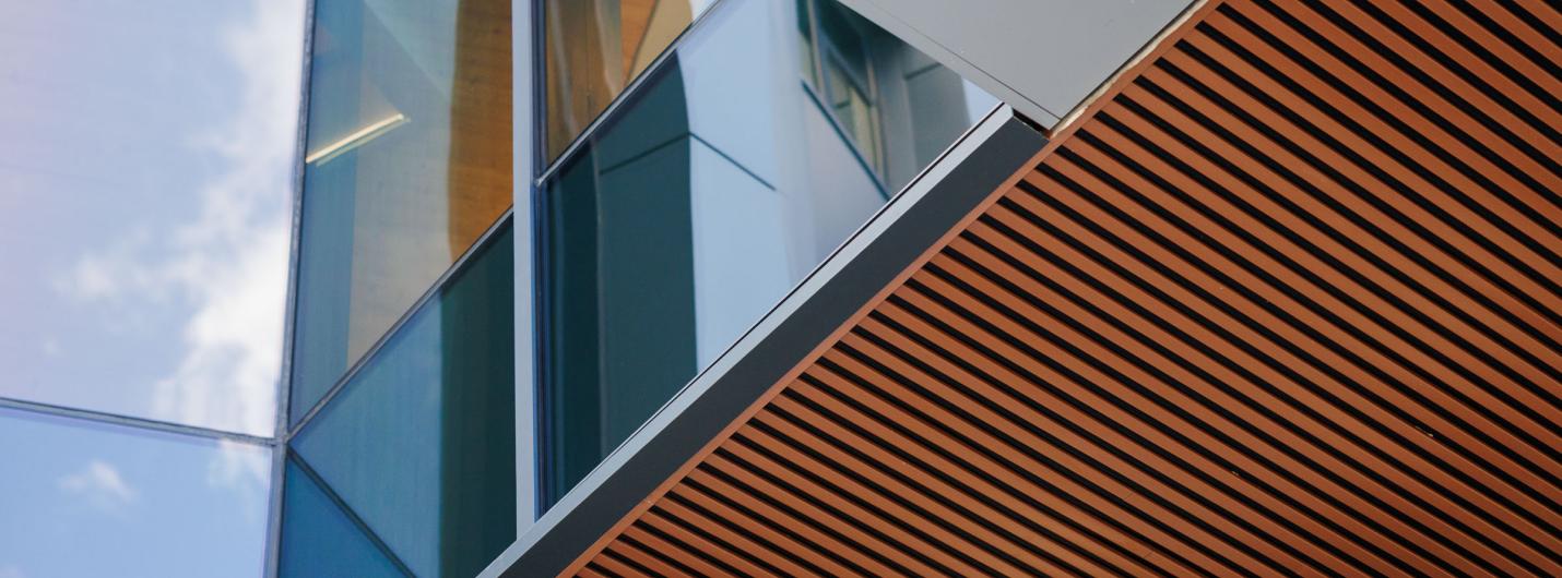 architecture sharp angles of a metal building with orange paneling
